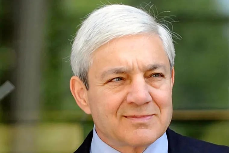 Former Penn State president Graham Spanier exits the Dauphin County Courthouse on July 29, 2013, in Harrisburg.