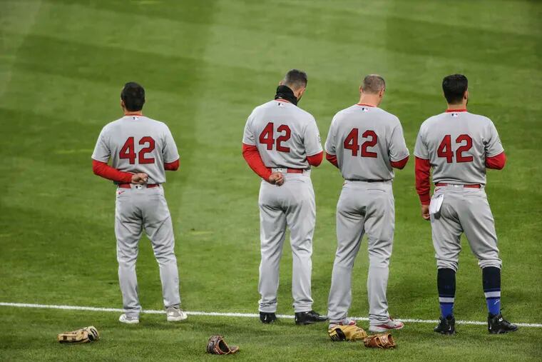In honor of Jackie Robinson both the Phillies and Cardinals here during the national anthem wore the #42 Robinson's number during game at Citizens Bank Park in Philadelphia, Friday, April 16, 2021