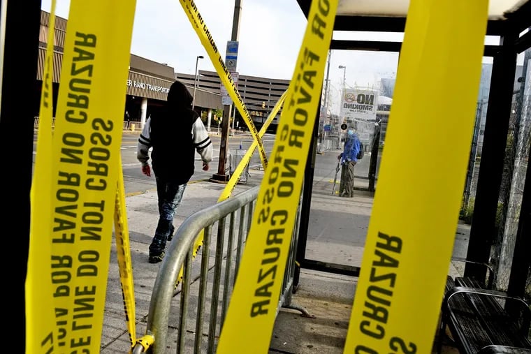 To maintain social distancing the NJ Transit bus shelters are closed off with yellow caution tape at the Walter Rand Transportation Center in Camden April 20, 2020, amid a massive decline in public transportation ridership because of the coronavirus crisis.