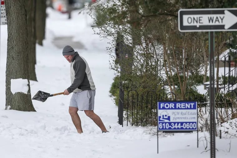 Mike Kiernan shovels in shorts — which is not recommended — during a snowfall in Phoenixville last year.
