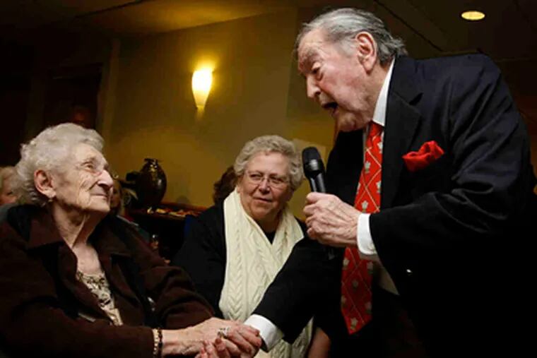 Harry Prime sings at the Meridian condos in Warrington, lavishing attention on Madeline Beine, 87. (Michael S. Wirtz / Staff Photographer)