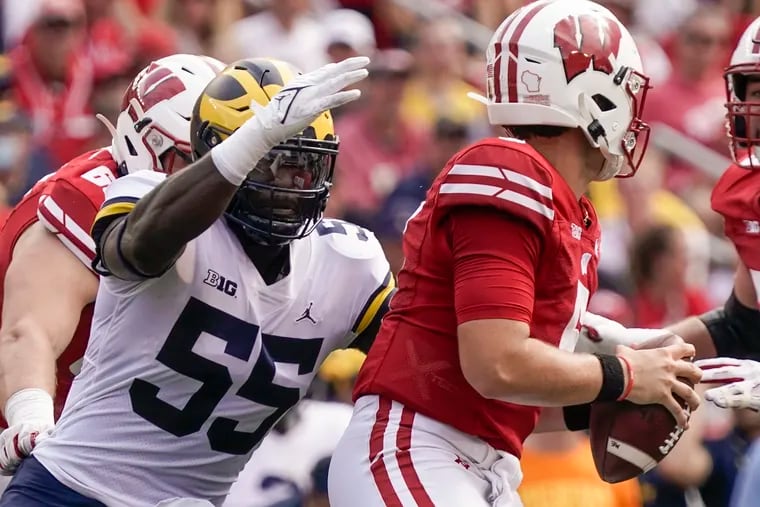 Michigan's David Ojabo sacks Wisconsin's Graham Mertz during the first half of an NCAA college football game on  Oct. 2.