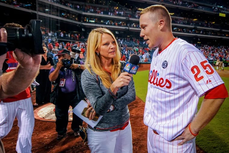 Former Comcast SportsNet anchor and reporter Leslie Gudel interviews former Phillies third baseman Cody Asche during the 2014 season.