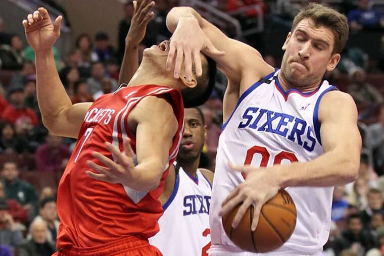 Spencer Hawes steals the basketball from Houston Rockets' Jeremy Lin during the fourth quarter on Wednesday, November 13, 2013. (Yong Kim/Staff Photographer)