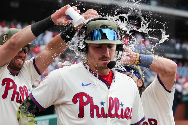 Philadelphia Phillies second baseman Bryson Stott gets soaked during a post-game interview after beating the Chicago Cubs.