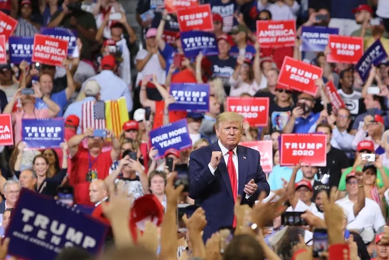 President Donald Trump responds to cheering supporters at Amway Center in Orlando, Fla., on Tuesday during his 2020 campaign kick-off rally.