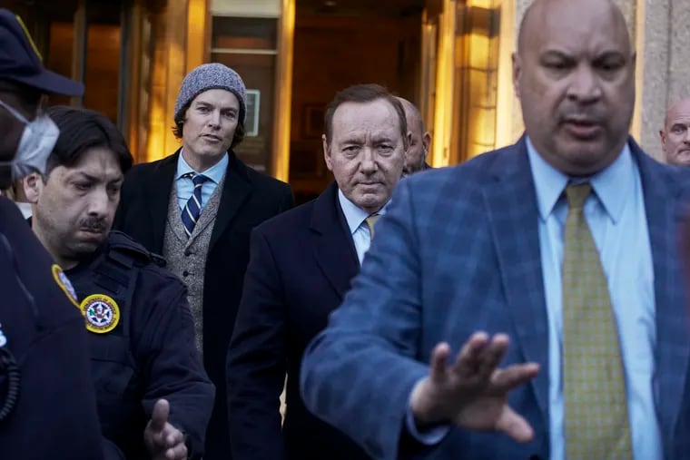 American actor Kevin Spacey, center, leaves the Daniel Patrick Moynihan Court House in New York. A jury sided with Spacey in one of the lawsuits that derailed the film star’s career, finding he did not sexually abuse Anthony Rapp, then 14, while both were relatively unknown actors in Broadway plays in 1980s.