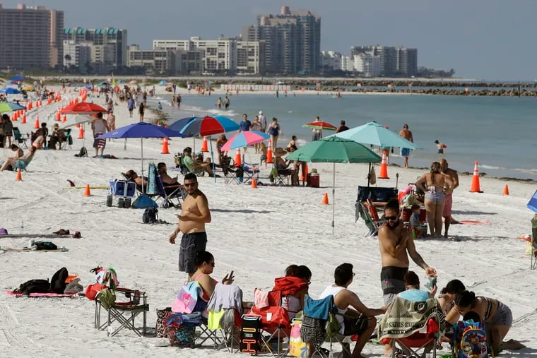 Cones are set up to help beachgoers keep a safe distance from one another after Clearwater Beach officially reopened to the public Monday.
