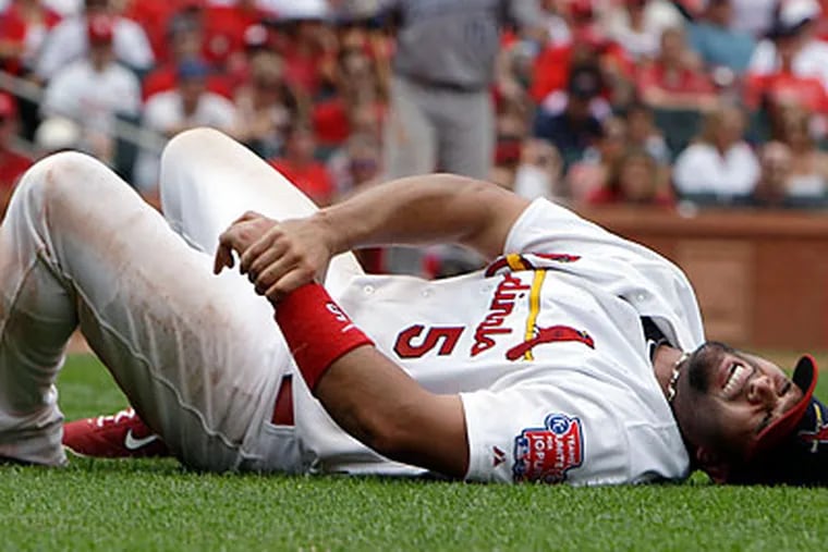 St. Louis Cardinals star Albert Pujols was injured Sunday in a collision at first base. (Jeff Roberson/AP file photo)