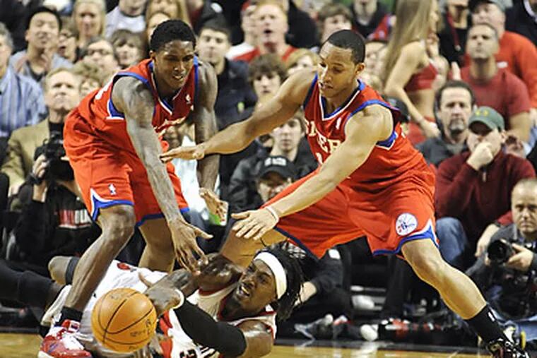 The 76ers committed 20 turnovers in Monday's season-opening loss to Portland. (Greg Wahl-Stephens/AP)