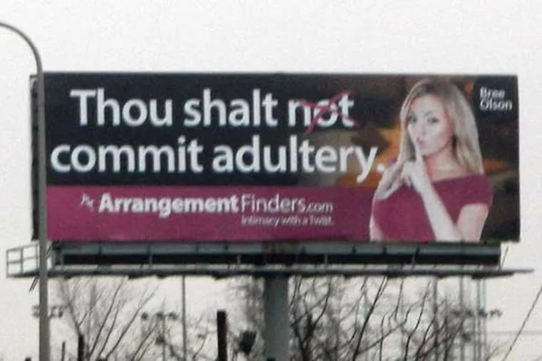 Bree Olson, a former porn star and Charlie Sheen partymate, on a billboard along I-95 for ArrangementFinders.com. (ed Hille / Staff Photographer)