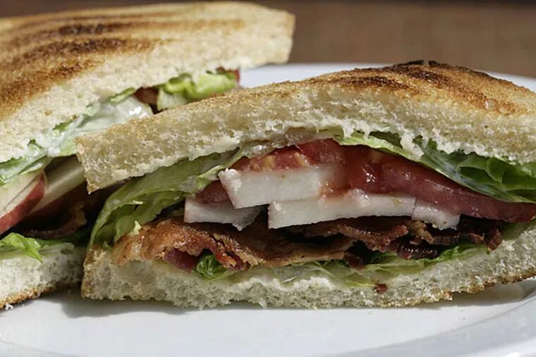 BLT With Cider Aioli. The classic sandwich gets a sweet and crunchy spin from apple slices and cider aioli. (PATRICIA BECK / Detroit Free Press)