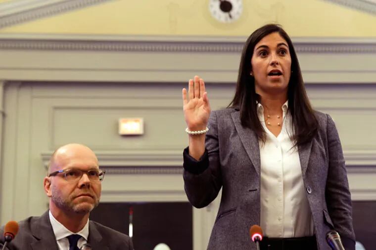 Former aide to Gov. Chris Christie, Christina Renna, being sworn in to testify before New Jersey lawmakers probing the George Washington Bridge lane closures scandal Tuesday, May 6, 2014 in Trenton, N.J. A legislative committee is investigating who was behind the politically motivated order to close lanes leading to the bridge last September. (AP Photo/Mel Evans)