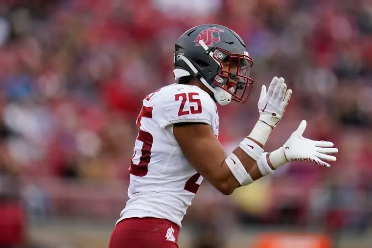 Washington State defensive back Jaden Hicks celebrates after returning a fumble recovery for a touchdown against Stanford in November 2022.