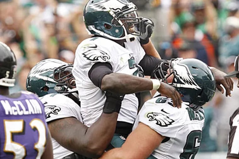 Michael Vick celebrates after scoring the game-winning touchdown against the Ravens. (Ron Cortes/Staff Photographer)