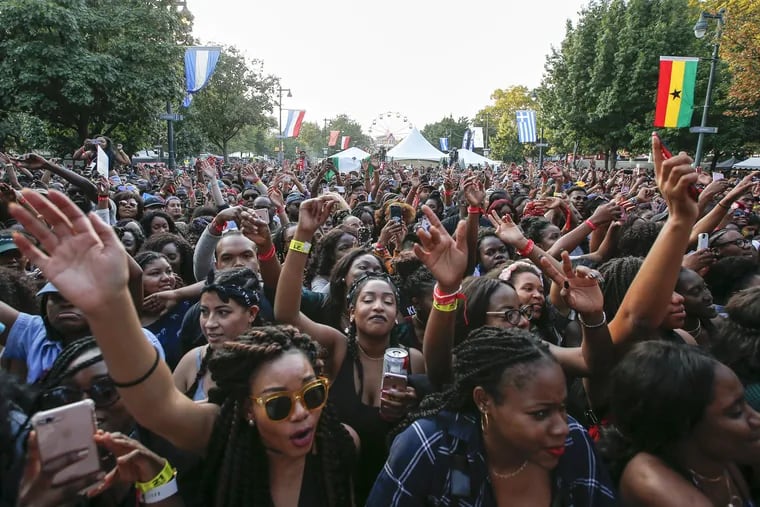 Fans wave their arms while Maleek Berry performed at the Tidal Stage during Made In America along the Benjamin Franklin Parkway on Sunday, September 3, 2017.