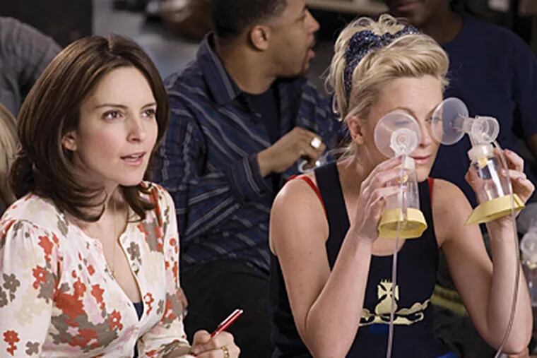 Tina Fey (left) and "Saturday Night Live" cohort Amy Poehler in a scene from "Baby Mama."