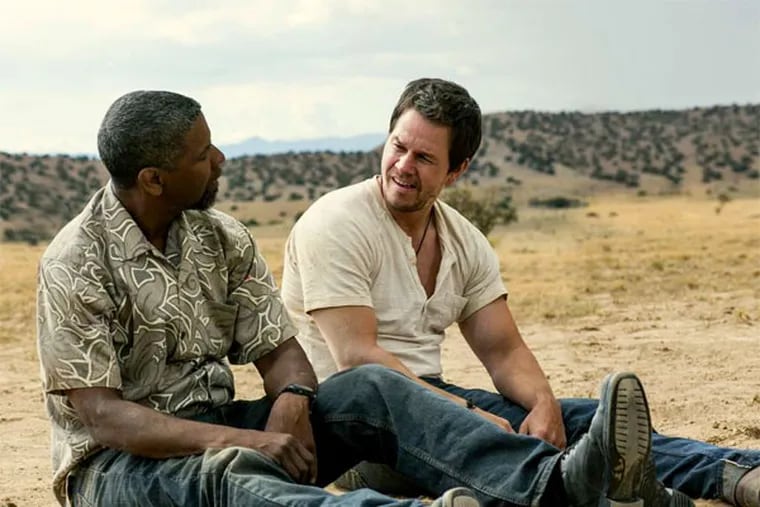 Denzel Washington and Mark Wahlberg star as a pair of wisecracking undercover investigators in &quot;2 Guns.&quot; (PATTI PERRET / Universal Pictures)