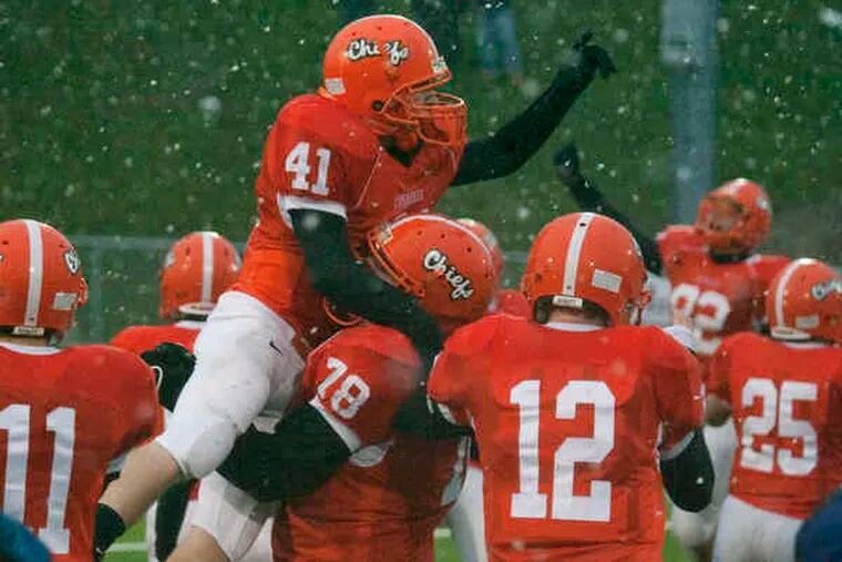Cherokee players celebrate their 14-0 victory over Egg Harbor Township in the South Jersey Group 4 final. The Chiefs finish the season as the Inquirer's top-ranked South Jersey team.