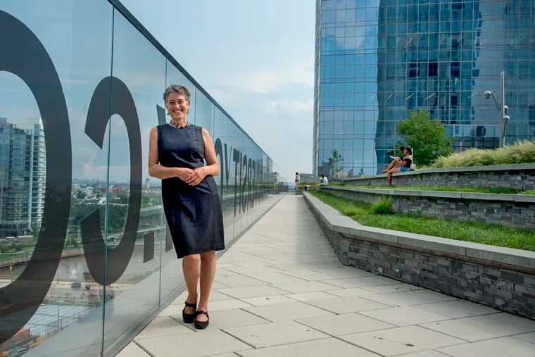 Melissa Muroff, president of Roofmeadow, poses at Cira Green Park August 7, 2018, the garage-top park her small business was hired to create. She is a proponent of all the SBN recommendations to increase small business' chances at getting jobs from government and major institutions in the city, but does not want to leave the impression that small businesses are looking for handouts.