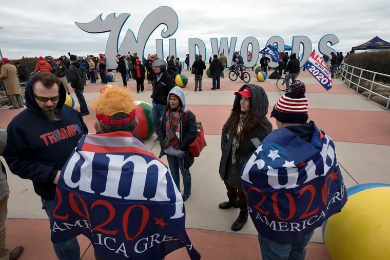 Supporters of then-President Donald Trump stand in a crowd near the iconic Wildwoods sign near the Wildwoods Convention Center as they wait to enter a campaign rally with Trump in Wildwood in January 2020.