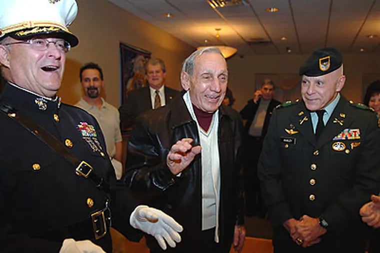 Frank Gagliardi of Philadelphia (center) received medals from World War II at a surprise party at the Community Center in Collingswood. (Sharon Gekoski-Kimmel/Staff Photographer)