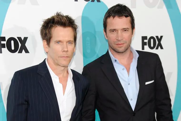"The Following" cast members Kevin Bacon, left, and James Purefoy attend the FOX network upfront presentation party at Wollman Rink, Monday, May 14, 2012 in New York. (AP Photo/Evan Agostini)