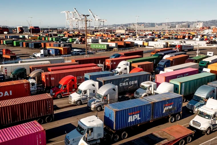 Trucks line up to enter a Port of Oakland shipping terminal on Nov. 10 in California.