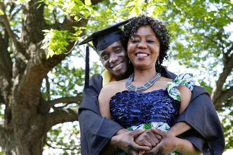 Frank Mulbah with his mother, Sarah Samuka. Mulbah, a refugee from Liberia, will graduate from Cheyney University with a degree in political science. He has plans to go to law school. (Michael S. Wirtz / Staff Photographer)