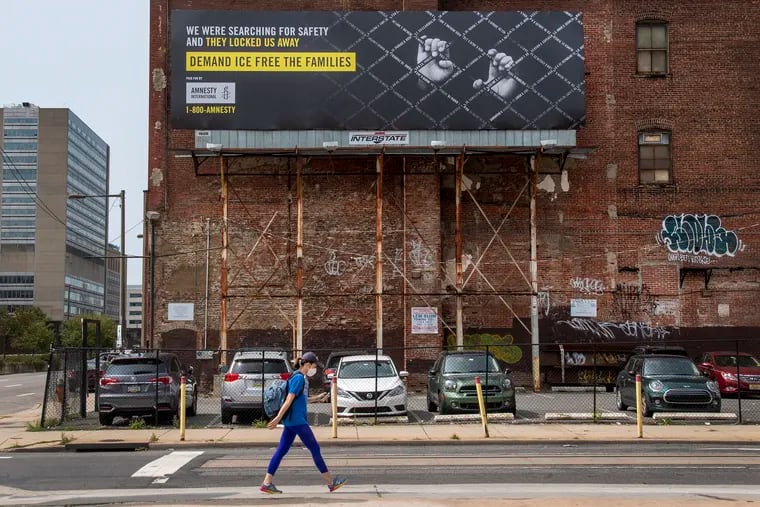 An Amnesty International billboard is shown along 12th Street, north of the Vine Expressway, in Philadelphia. The billboards were going up in several American cities to urge ICE to free detained immigrant families.