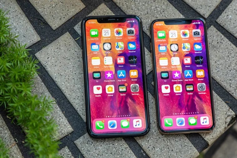 The 6.1-inch iPhone XR, left, is a bit larger than the 5.8-inch iPhone XS.