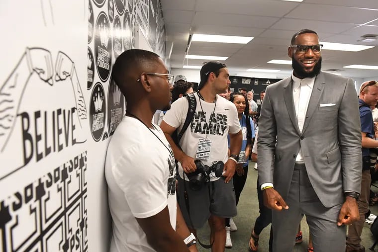 LeBron James finishes a news conference in a classroom at the I Promise School in Akron, Ohio, on Monday, July 30, 2018. LeBron James partnered with the University of Akron to guarantee all of his school's students college scholarships.