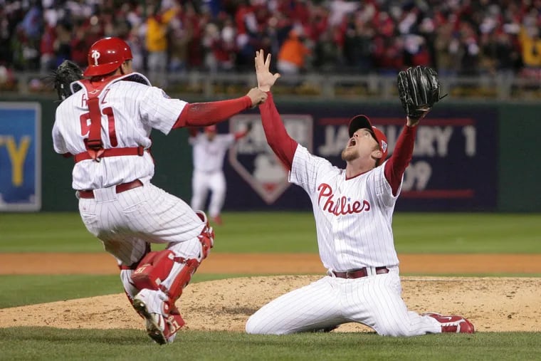 Brad Lidge drops to his knees after throwing the final pitch of the 2008 World Series and striking out Tampa Bay's Eric Hinske.