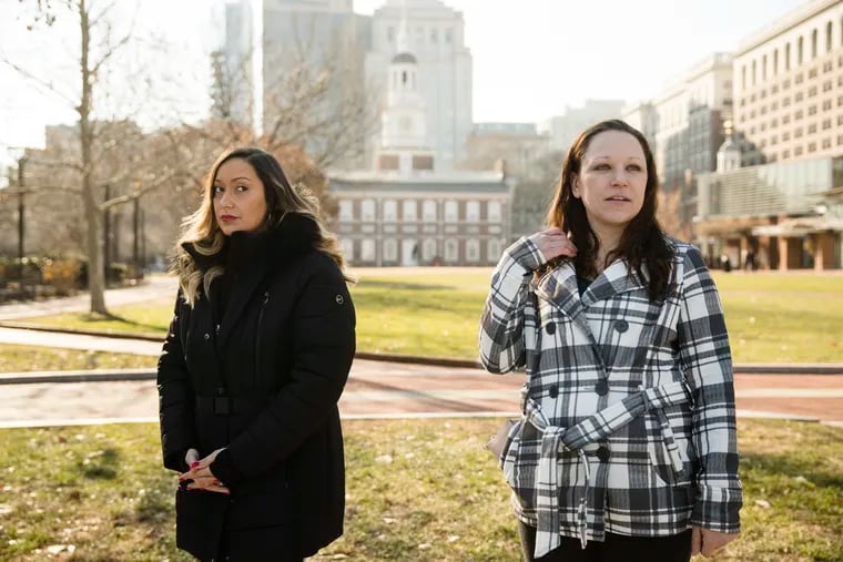 Courtney Haveman and Amanda Spillane speak with members of the media during a news conference in view of Independence Hall in Philadelphia, Wednesday, Dec. 12, 2018. Haveman and Spillane, who were denied licenses to work as estheticians as a result of running afoul of a state good moral character rule, due to past drug-related convictions, are challenging the regulation in a lawsuit. (AP Photo/Matt Rourke)