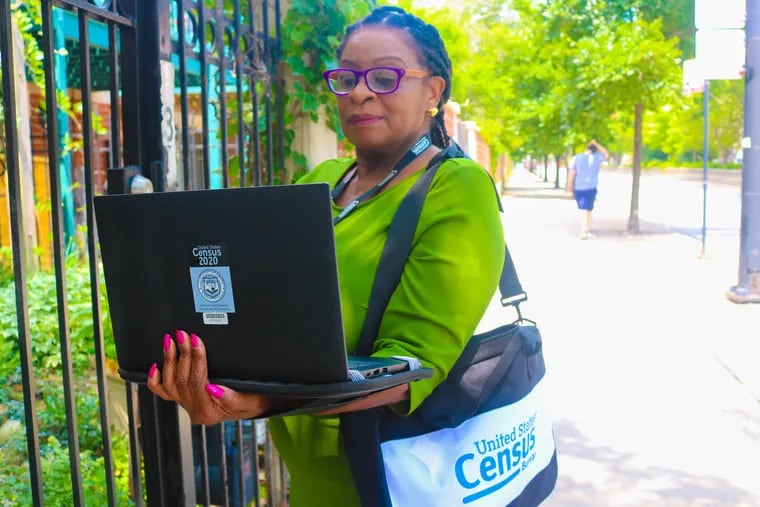 A Census Bureau worker demonstrates the work the address canvassers, called "listers," will do to verify household addresses ahead of the 2020 Census.