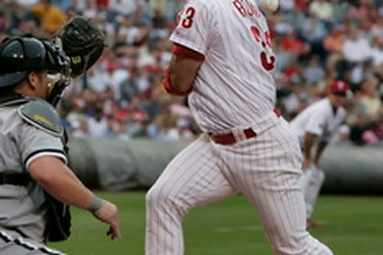 Aaron Rowand gets hit by a pitch to load the bases and allow the Phillies to get their first run after the next batter was walked.