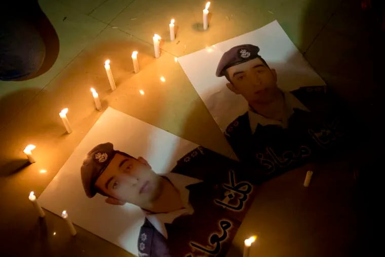 A candlelight vigil is held in Karak, Jordan, for Lt. Muath al-Kaseasbeh, a pilot captured by the Islamic State militants when his fighter jet went down over Syria in December.