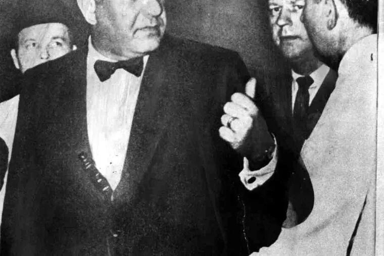 The famous 1969 photo of then-Police Commissioner Frank L. Rizzo in formal dress, with a nightstick in his cummerbund.