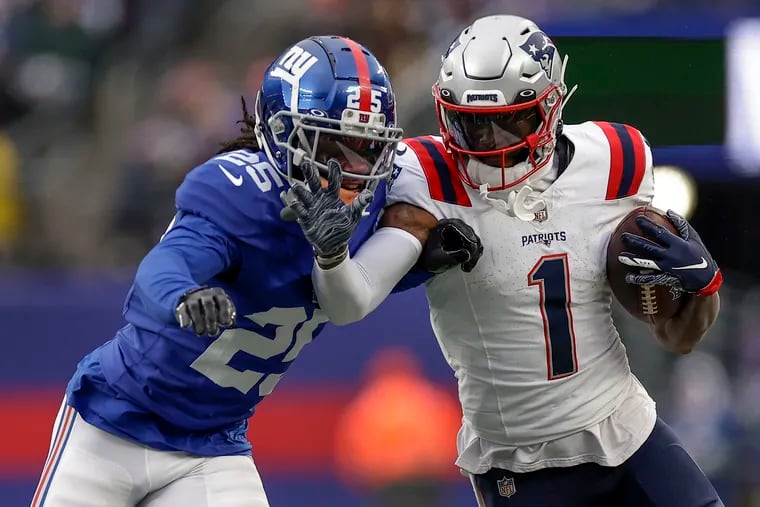 New England Patriots wide receiver DeVante Parker is pushed out of bounds by the Giants' Deonte Banks on Nov. 26.