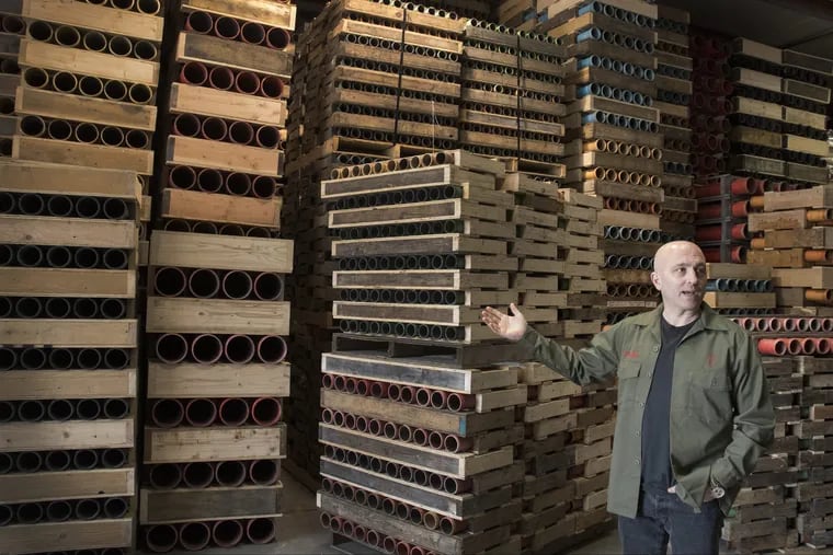 FIREWORKS03P – Stephen Vitale, President and CEO of Pyrotecnico, a fireworks display company, stands next to hundreds of mortar racks used to hold fireworks for shows April 23, 2018. Pyrotecnico is located in New Castle, Pa., sometimes referred to as the Fireworks Capitol of America. Photo by John Beale
