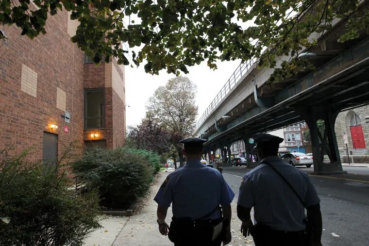 15th District Philadelphia Police Officers Josh Daniels (left) and Arne-Vaughn on foot patrol in the Frankford section of Philadelphia on Monday, September 29, 2014. 