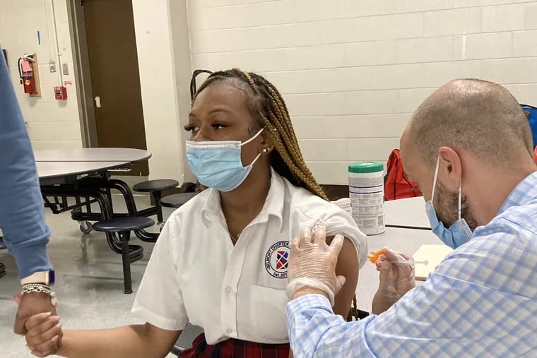 Tashaira Jackson, 12th Grade at Belmont Charter High School, receiving her vaccine during last month's clinic. Source: Belmont Charter Network