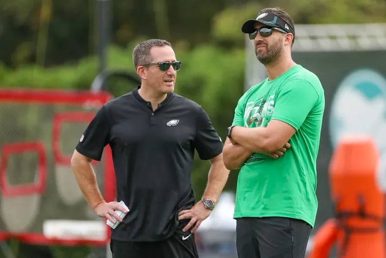 Eagles general manager Howie Roseman speaks with head coach Nick Sirianni during training camp at the NovaCare Complex in Philadelphia on Saturday, Aug. 6, 2022.