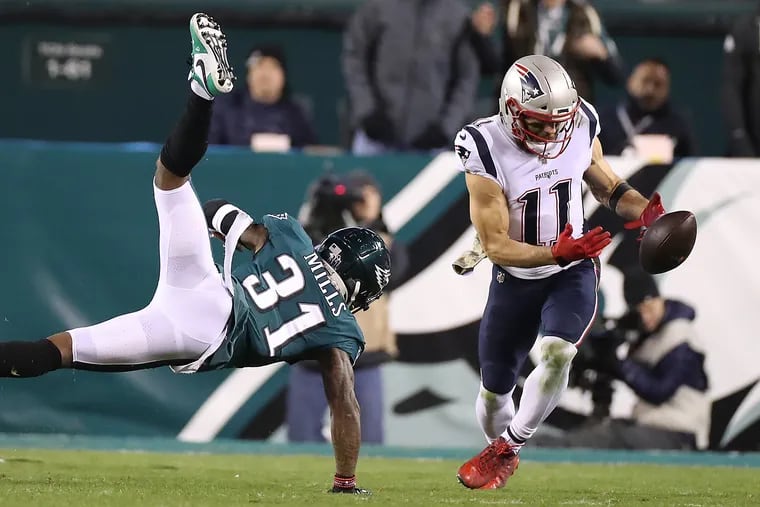 New England Patriots wide receiver Julian Edelman (right) drops a pass as Eagles cornerback Jalen Mills defends him during the second quarter.