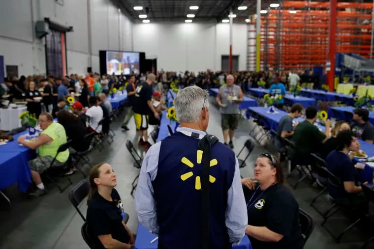 A Walmart e-commerce fulfillment center opened in Lehigh Valley in 2015. Here, Walmart U.S. president and CEO Greg Foran talks with employees at during a gathering for a preview at the Bethlehem facility. Planned layoffs in June will affect 597 people at the 3215 Commerce Center Blvd. facility.