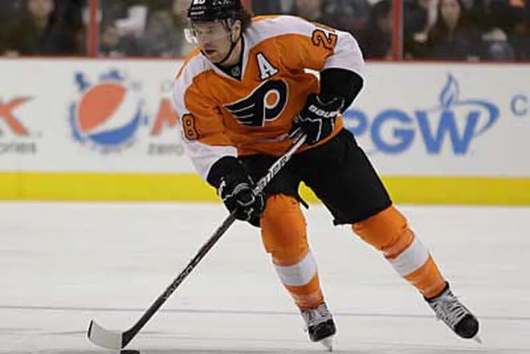 Claude Giroux failed a baseline concussion test on Monday and sat out Tuesday's game. (AP Photo / Matt Slocum)