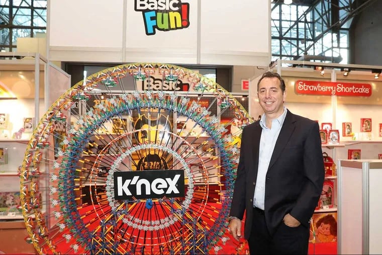 "Jay Foreman, CEO of Basic Fun!, poses with K'NEX products after Basic Fun's acquisition of the company this year. The firm will be hit by Chinese tariffs if the trade war escalates.
