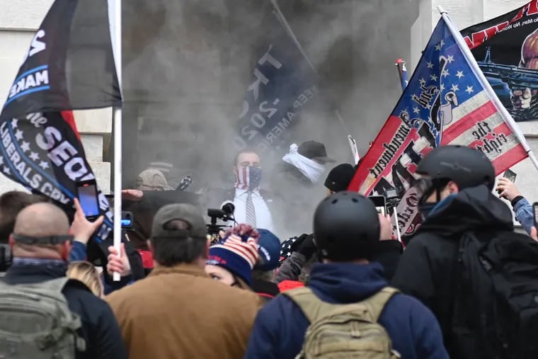 Trump supporters are tear gassed outside the U.S. Capitol in Washington, D.C. on Wednesday, Jan. 6, 2021. The group breeched security and entered the Capitol as Congress debated the a 2020 presidential election Electoral Vote Certification.