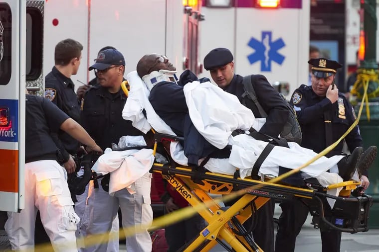 A victim is placed in an ambulance after a gunman emerged from a crashed Home Depot truck and opened fire after apparently plowing down four riders Tuesday afternoon on a Lower Manhattan bike path Oct. 31, 2017 in Manhattan, N.Y. The New York Police Department reported one man was in custody after initial reports of gunfire set off a mad scramble in the downtown area. Police flooded the area shortly after the first shots were fired around 3 p.m. (James Keivom/New York Daily News/TNS)