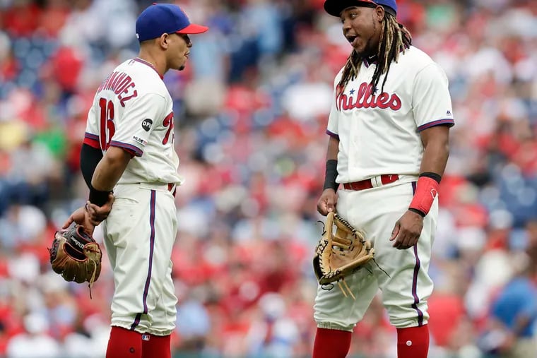 Maikel Franco, left, and Cesar Hernandez came up together through the Phillies' farm system. The team must decide by 8 p.m. Monday whether to offer 2020 contracts to both players or cut them loose as free agents.